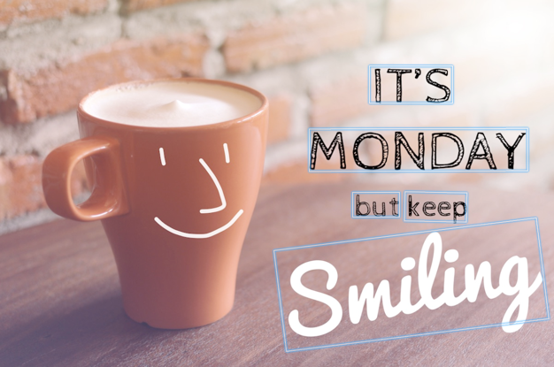 咖啡杯带有笑脸和文本“It's Monday but keep smiling”，带有边界框和提取的文本。