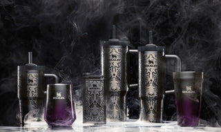 Stanley Halloween collection tumblers with skull and flame designs, displayed in smoky black and silver.
