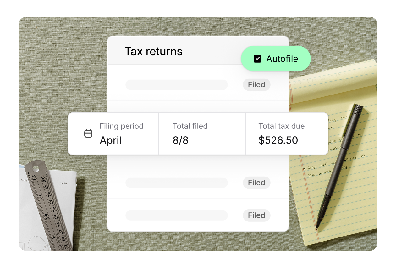 A tax returns dashboard shows autofile enabled, with April as the filing period, 8 of 8 returns filed, and $526.50 total tax due. A notepad, pen, and ruler are in the background.