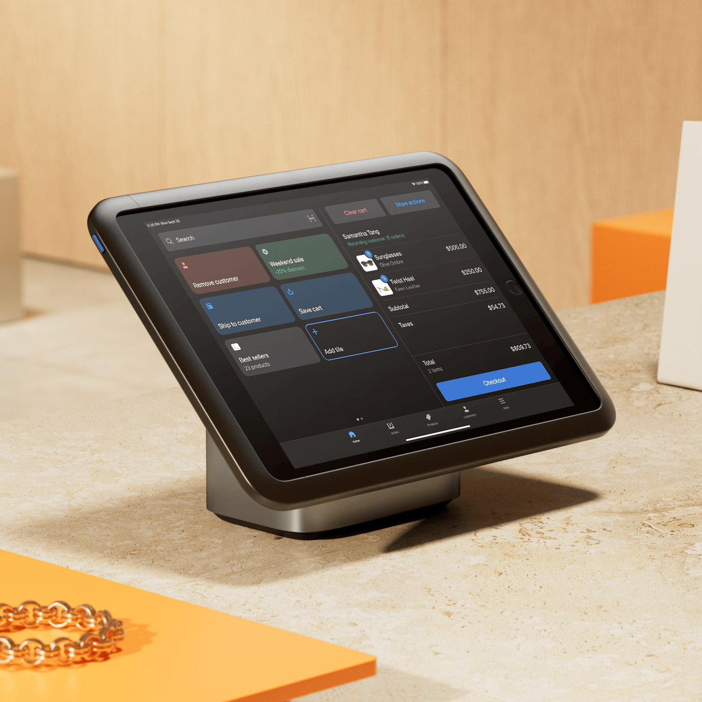 A customer swipes their card on Shopify POS Terminal which displays a payment total and options to tap, insert, or swipe on its screen.