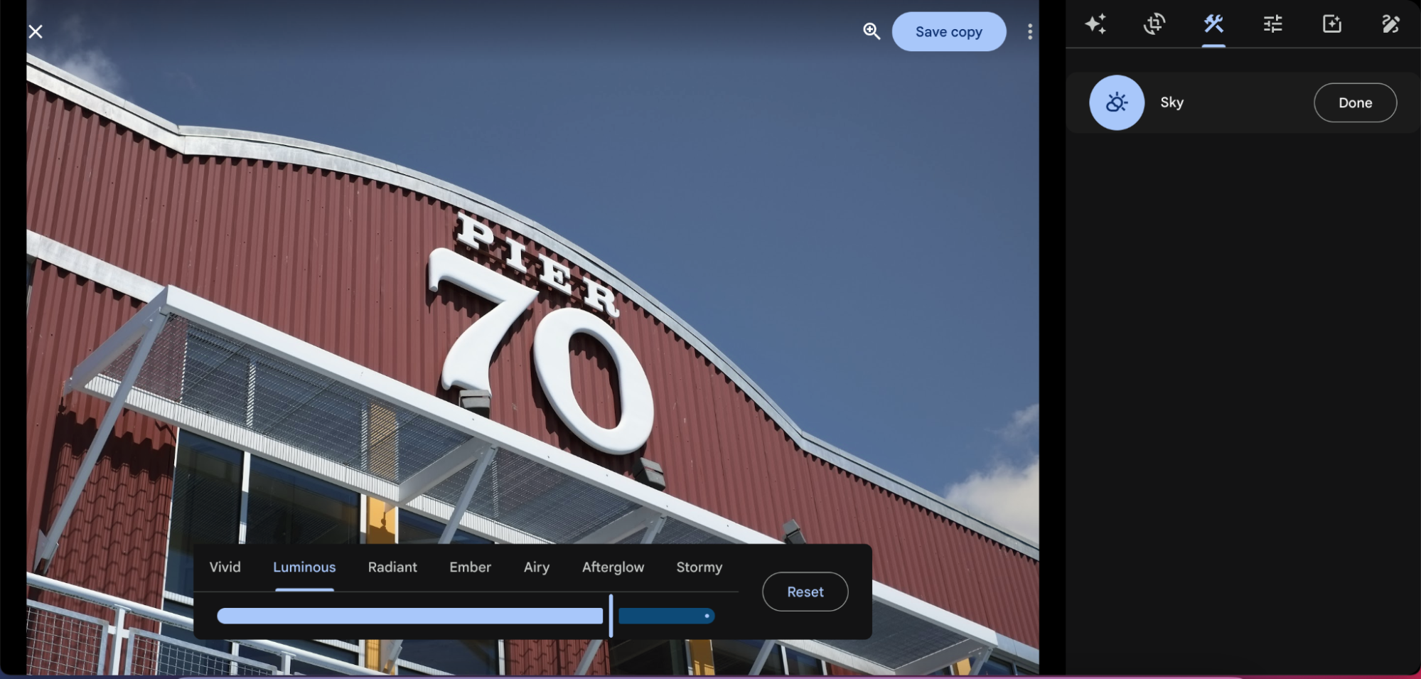 A photo of the front of a building with a Google Photos UI sidebar to make image adjustments.