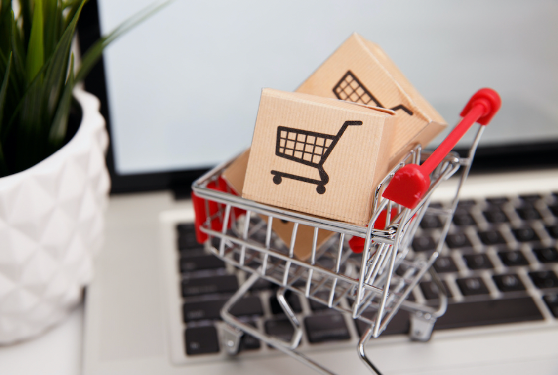 A mini shopping cart with boxes in it